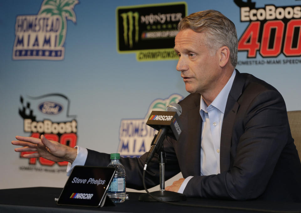NASCAR President Steve Phelps speaks to the media during a press conference before the NASCAR Cup Series auto race on Sunday, Nov. 17, 2019, at Homestead-Miami Speedway in Homestead, Fla. (AP Photo/Terry Renna)