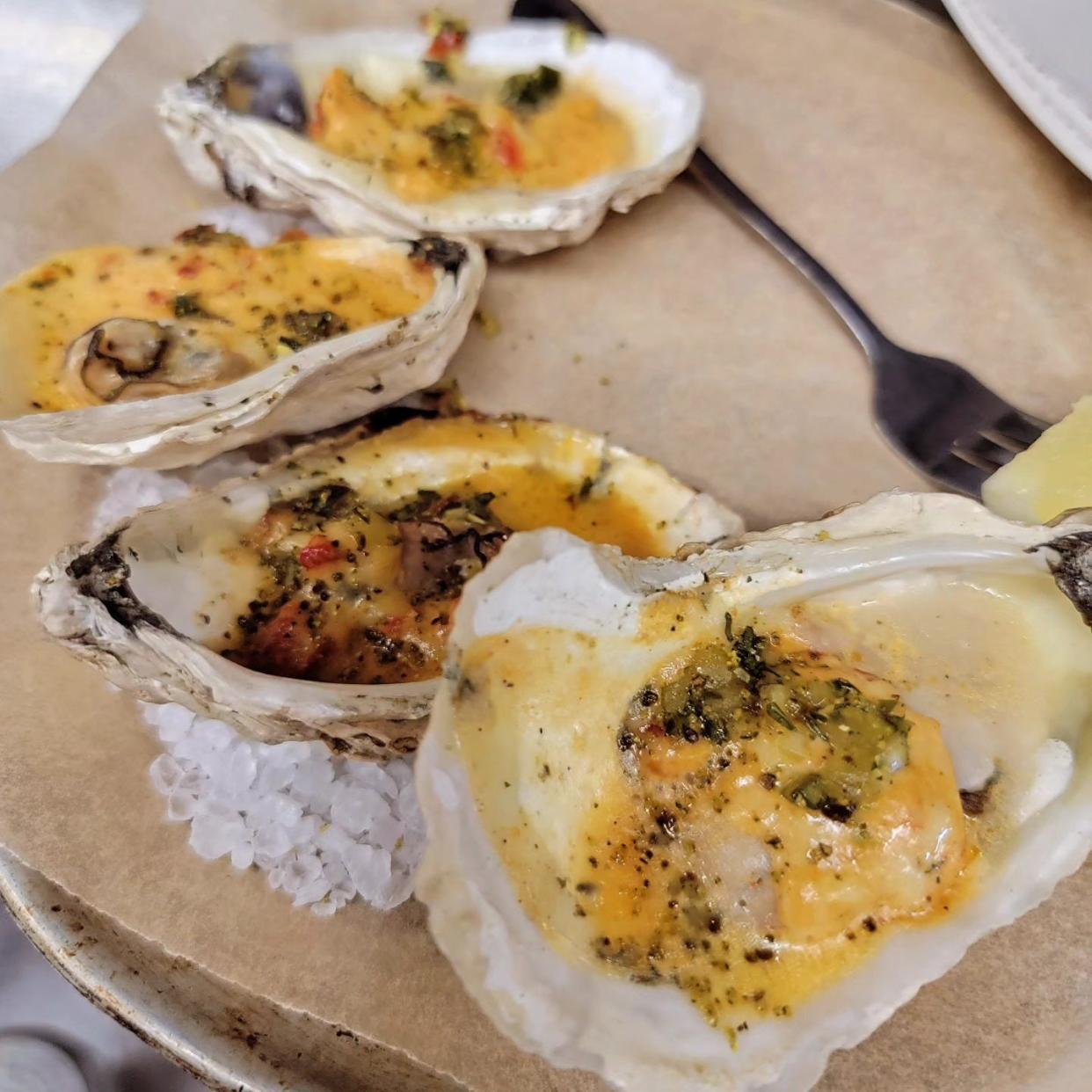 Wood-grilled oysters, pimento cheese and pickle relish with pickle dust at Smoky Park Supper Club.