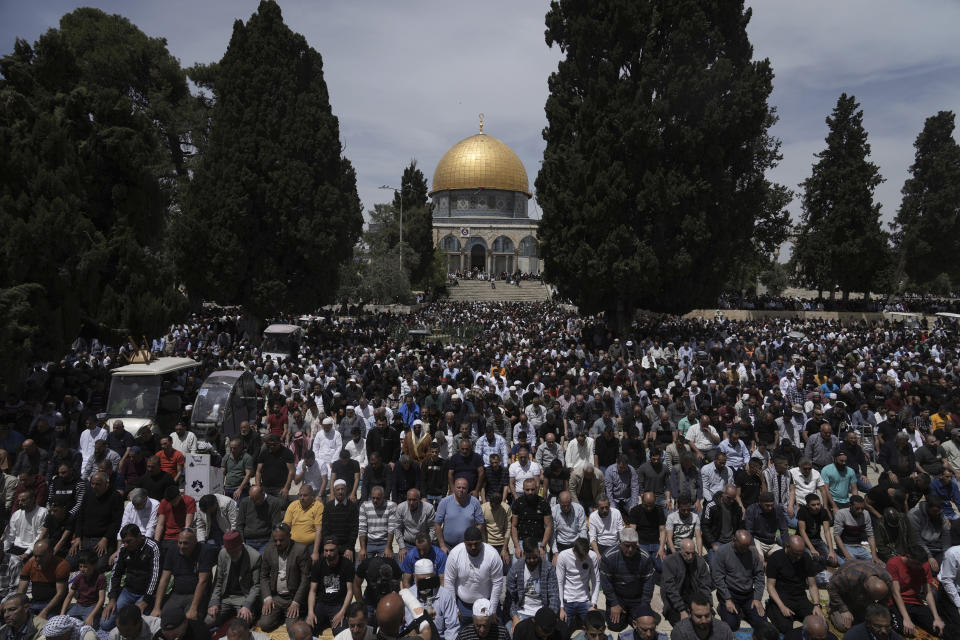 Palestinians gather for Friday prayers during the Muslim holy month of Ramadan, hours after Israeli police clashed with protesters at the Al Aqsa Mosque compound, in Jerusalem's Old City, Friday, April 22, 2022. (AP Photo/Mahmoud Illean)