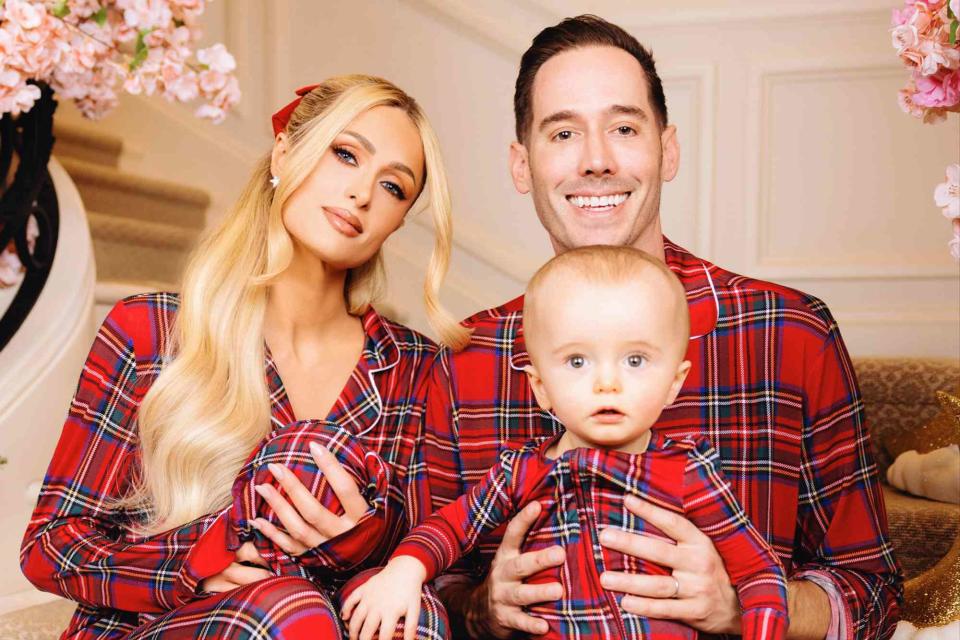 <p>Szymon Dybowski</p> Paris Hilton and Carter Reum with son Phoenix and daughter London in 2023 Christmas photos