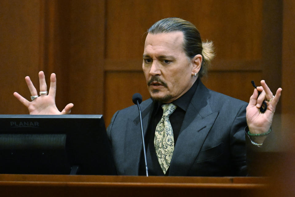 Actor Johnny Depp testifies during a hearing at the Fairfax County Circuit Court in Fairfax, Va., Tuesday April 19, 2022. Depp sued his ex-wife Heard for libel in Fairfax County Circuit Court after she wrote an op-ed piece in The Washington Post in 2018 referring to herself as a "public figure representing domestic abuse." (Jim Watson/Pool Photo via AP)