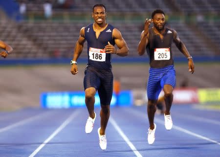 Athletics - JAAA National Senior Championships - Men's 200m final - National Stadium Kingston, Jamaica - June 25, 2017 Jamaica's Yohan Blake (L) and Rasheed Dwyer in action. REUTERS/Lucy Nicholson