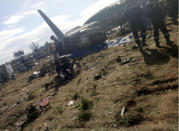 <p>This image dated on April 11, 2018, and posted by Algerian news agency ALG24, shows firefighters and soldiers at the scene of a fatal military plane crash near Boufarik military base near the Algerian capital, Algiers. (Photo: ALG24 via AP) </p>