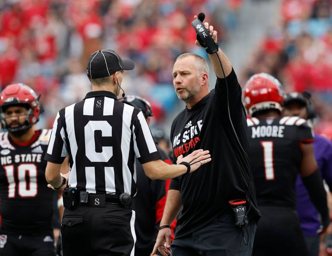 N.C. State head coach Dave Doeren pleads with an official during the first half of N.C. State’s game against Maryland in the Duke’s Mayo Bowl at Bank of America Stadium in Charlotte, N.C., Friday, Dec. 30, 2022.