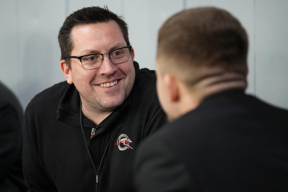 Rick Dunkle talks with a student during a day-long broadcast of back-to-back NCAA Division II midwest regional basketball games Saturday, March 11, 2023, at Nicoson Hall at the University of Indianapolis. Dunkle is from Franklin, Indiana, but worked as a writer and producer in Los Angeles for the past two decades. He returned to Indiana to lead the school's student broadcast network, UINDY TV, and serve as assistant professor of practice for the department of communication. 