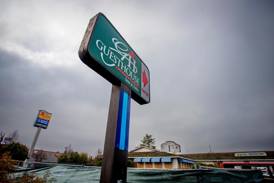 A sign advertises the GuestHouse Inn and Suites on Gateway Street in Springfield on Thursday after residents received notice the building was being condemned.