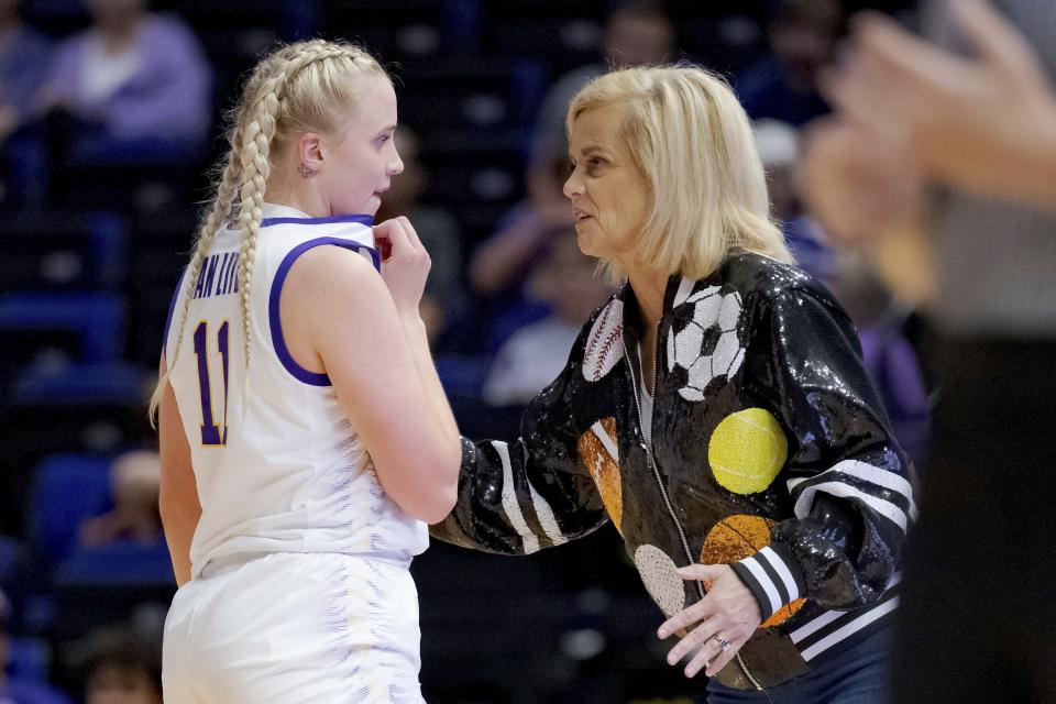 LSU guard Hailey Van Lith (11) talks with coach Kim Mulkey during the first half of the team's NCAA college basketball exhibition game against East Texas Baptist, Thursday, Oct. 26, 2023, in Baton Rouge, La. (AP Photo/Matthew Hinton)