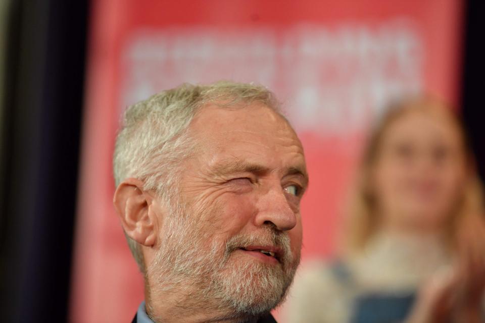 Jeremy Corbyn winks to a colleague at a rally in Hastings on Thursday (Ben Stansall/AFP/Getty Images)