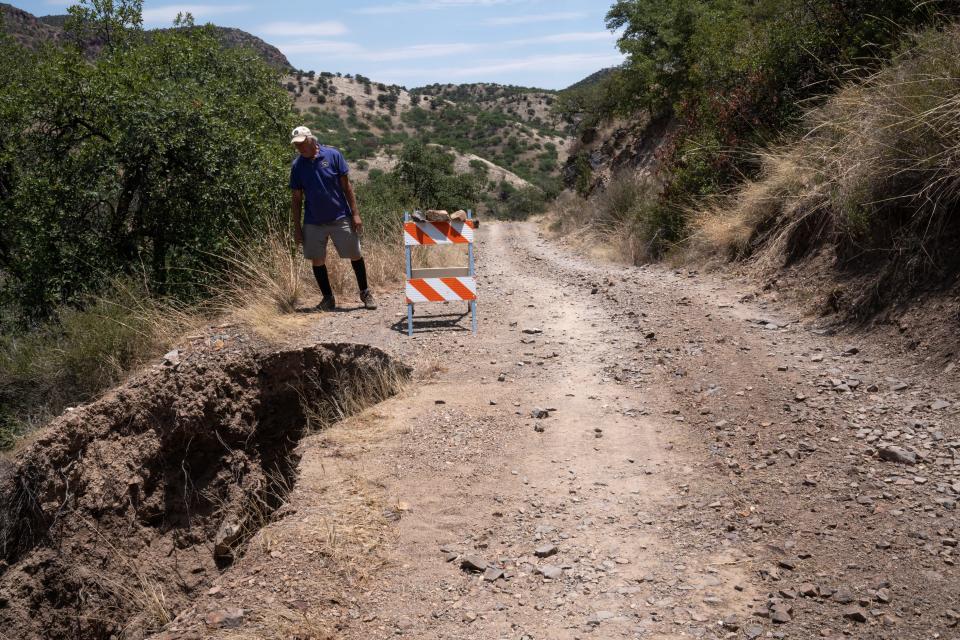 Activist Robert Gay checks the erosion on Flex Canyon Road (Forest A12) before driving to Hermosa Mine, near Patagonia on June 18, 2023.