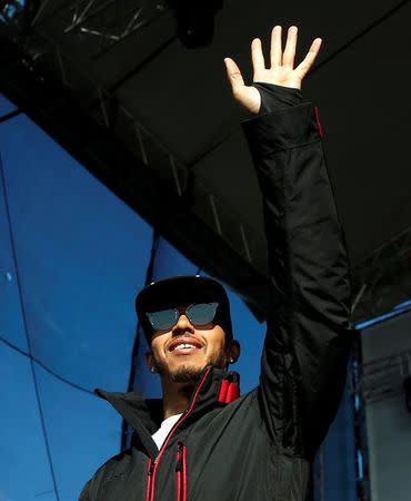 Formula One - Russian Grand Prix - Sochi, Russia - 28/4/16 - Mercedes Formula One driver Lewis Hamilton of Britain waves during an autograph session. REUTERS/Maxim Shemetov