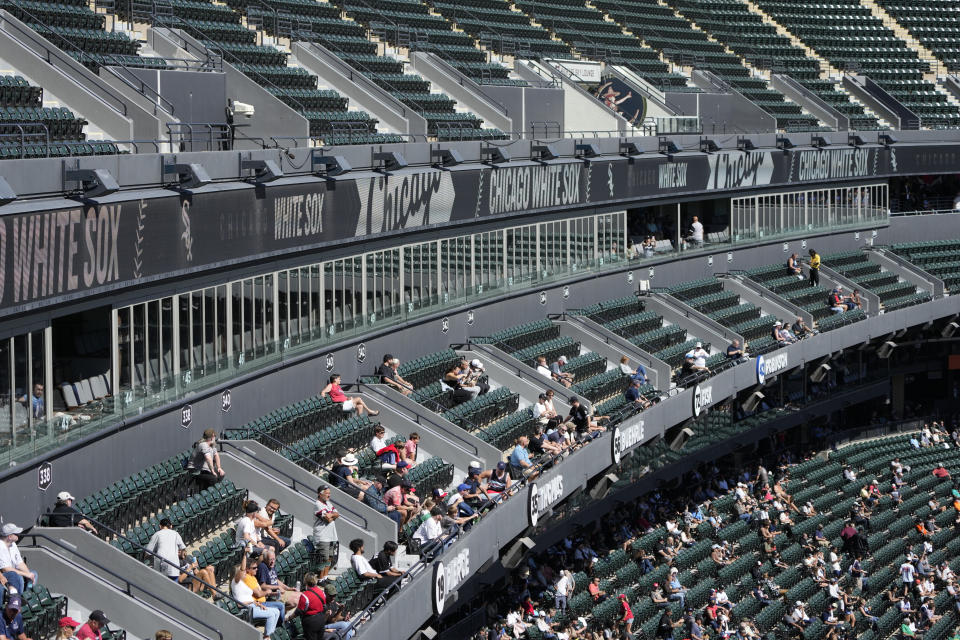 Fans watch the third inning of a baseball game between the Chicago White Sox and the Los Angeles Angels, Thursday, Sept. 26, 2024, in Chicago. (AP Photo/Charles Rex Arbogast)