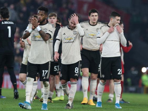 Man United players applaud the away supporters at Anfield (Getty)