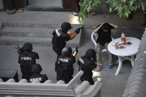 Chinese police take part in an exercise in Beijing. China uses three methods of locking up suspects -- formal arrest, formal detention and "residential surveillance", which can be at home or in other locations, usually hotels or guesthouses