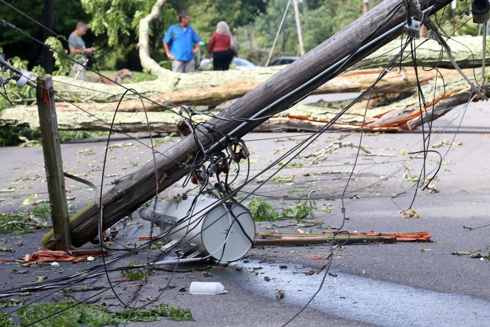 A transformer and pole on the ground on Pearl Street in Kingston the morning after a violent storm swept through the Kingston area  July 14, 2022. 