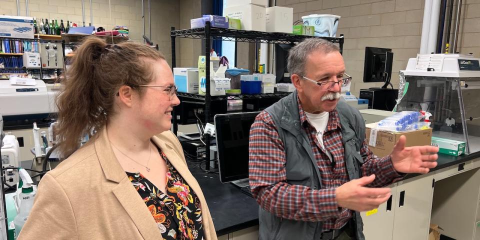 Brian Barkley, right, visits the Carleton University lab to see how sap samples are tested while researcher Erin McConnell, left, looks on.