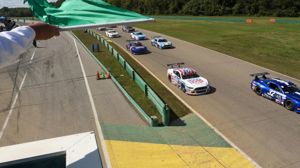 a group of race cars on a race track