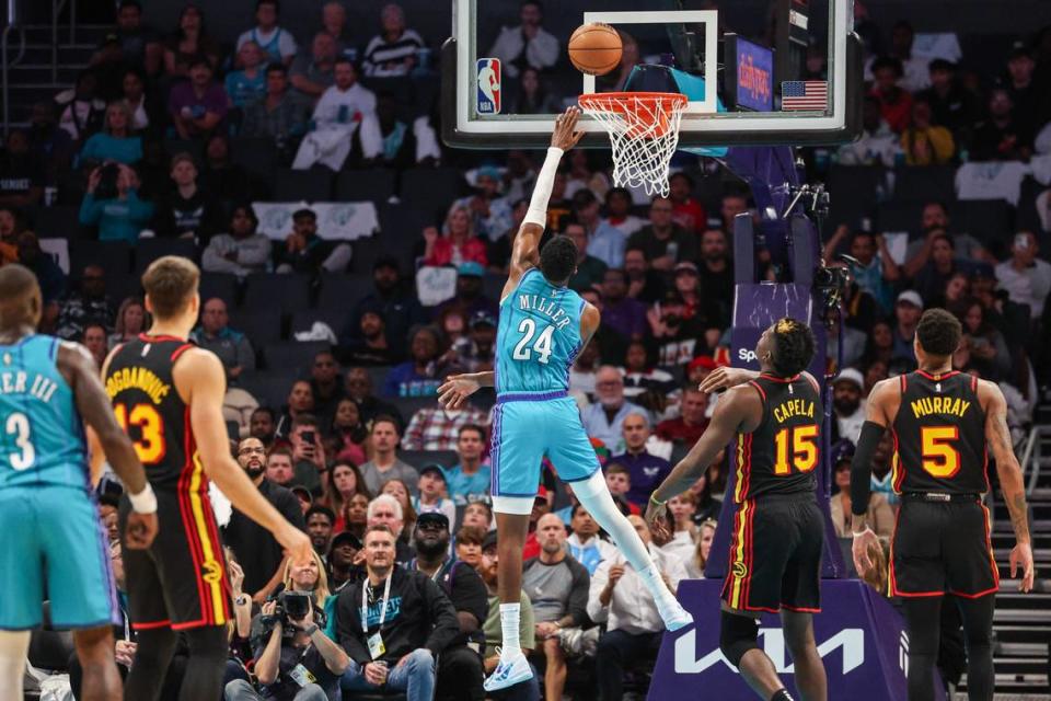 Charlotte Hornets rookie Brandon Miller, center, takes the ball to the hoop for two points during the season-opening game against the Atlanta Hawks at Spectrum Center on Wednesday, October 25, 2023. Charlotte won, 116-110, with Miller scoring eight of his 13 points in the fourth quarter.