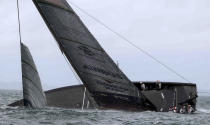 United States' American Magic capsizes during it's race against Italy's Luna Rossa on the third day of racing of the America's Cup challenger series on Auckland's Waitemate Harbour, New Zealand, Sunday, Jan. 17, 2021. (Michael Craig/NZ Herald via AP)