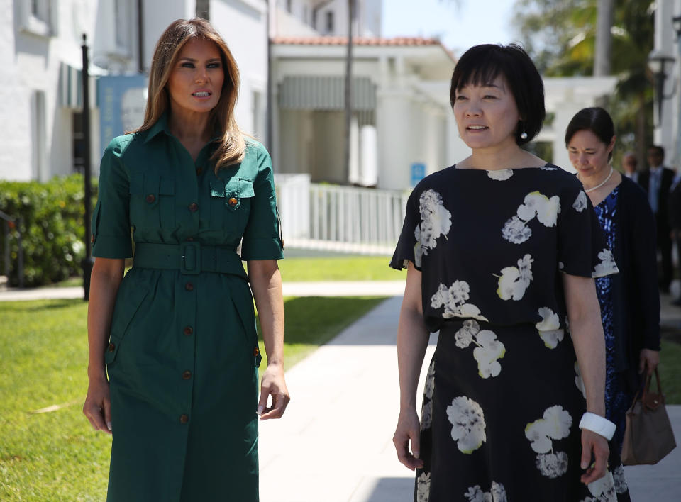 First lady Melania Trump rocked a green shirtdress for a visit with Japanese first lady Akie Abe. (Photo: Getty Images)