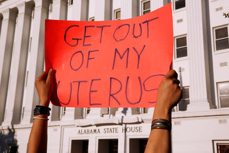 FILE PHOTO: Pro-choice supporters protest in front of the Alabama State House as Alabama state Senate votes on the strictest anti-abortion bill in the United States at the Alabama Legislature in Montgomery, Alabama, U.S. May 14, 2019. REUTERS/Chris Aluka Berry/File Photo