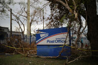 <p>A U.S. Postal Service office sign is seen at a damaged area of San Juan after Hurricane Maria, in Puerto Rico, Oct. 5, 2017. (Photo: Carlos Barria/Reuters) </p>