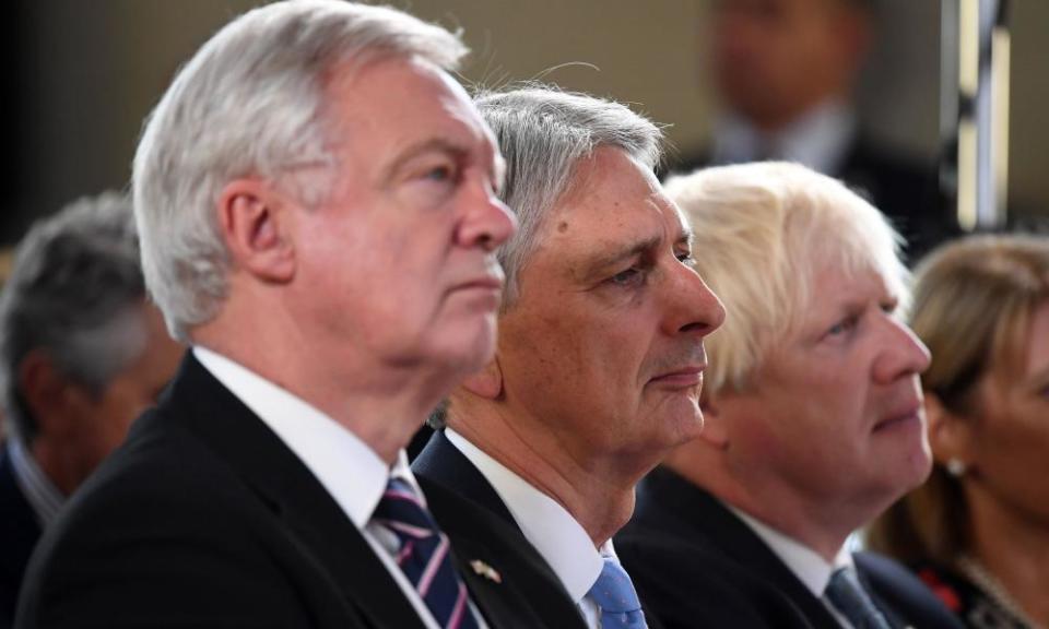 Brexit Secretary David Davis, Chancellor Philip Hammond and Foreign Secretary Boris Johnson listen as Prime Minister Theresa May delivers her speech.