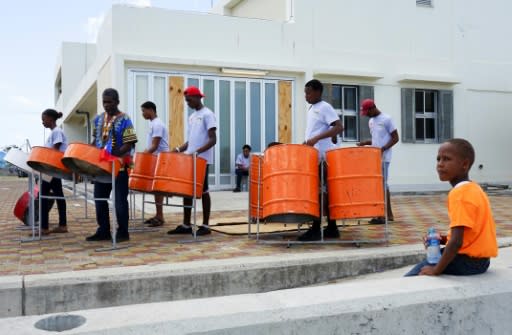 A steel drum band celebrated a Chinese-funded program to replace roofs ripped from more than 300 Barbuda homes by Hurricane Irma last September