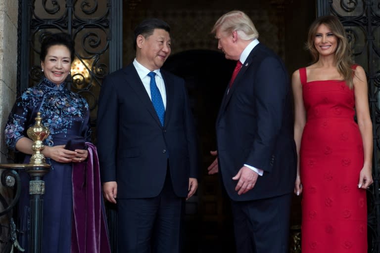 US First Lady Melania Trump (R) and US President Donald Trump (2nd R) welcome Chinese President Xi Jinping (2nd L) and his wife Peng Liyuan (L) to the Mar-a-Lago estate in West Palm Beach, Florida, on April 6, 2017