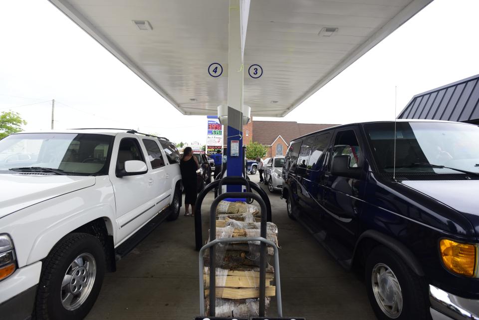 People fill up on gas at the Marathon gas station on Main Street in Lexington on Monday, June 6, 2022. The gas station offered $1 off per gallon beginning at 10 a.m. through People Helping People, an initiative supported through donations from local businesses.
