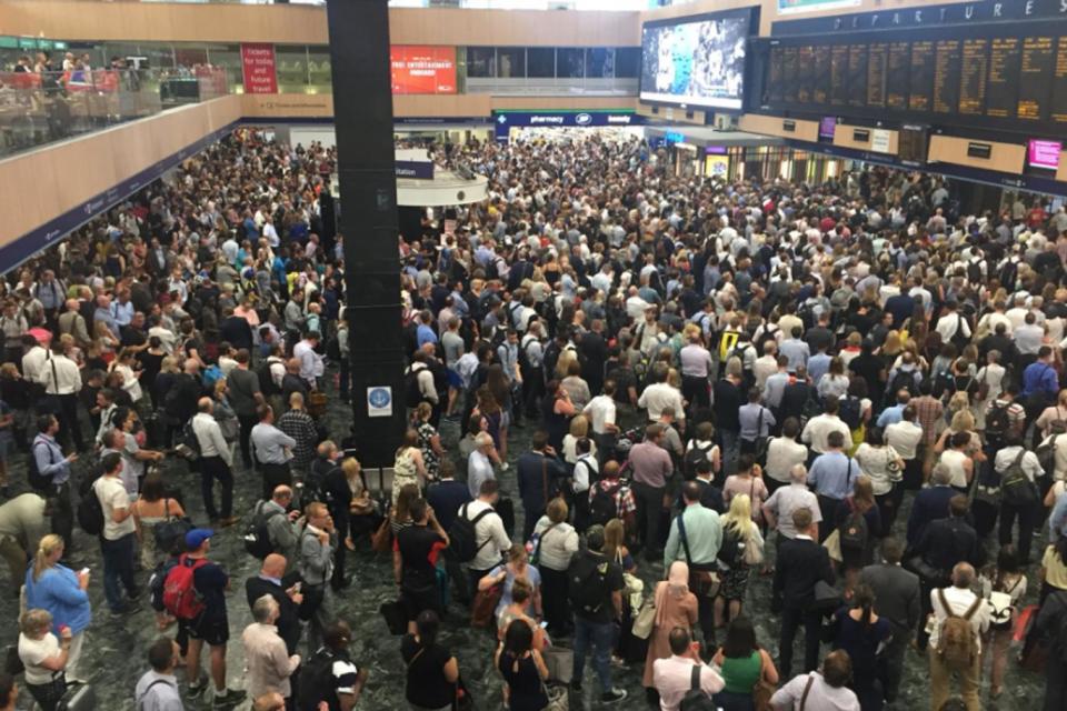 People wait for cancelled trains at Euston Station (Twitter)