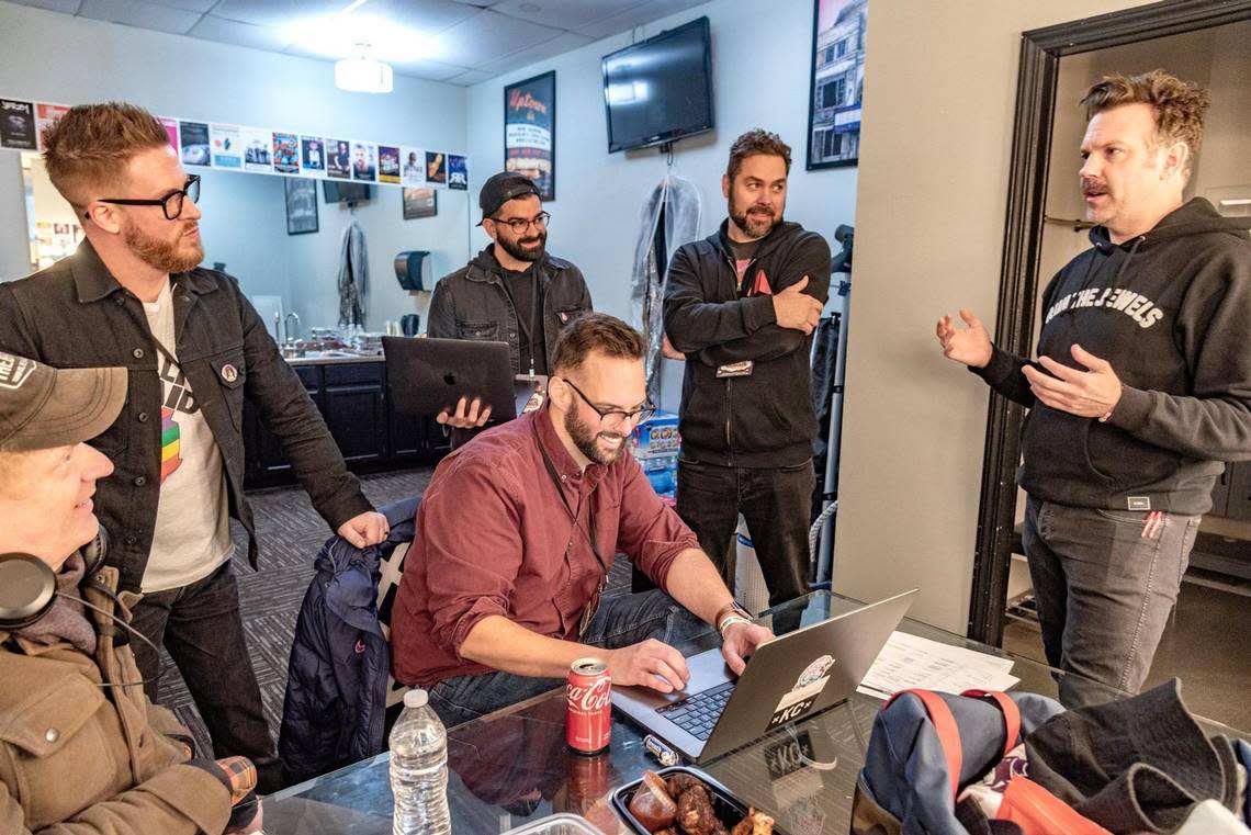 Jason Sudeikis, right, wrapped up details of Thundergong! backstage at the Uptown Theater with, from left, Ed Goodman, Billy Brimblecom, Dustin Schiver, seated, Randall Statlar and Brandon Wood.