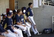 Milwaukee Brewers' Ryan Braun waits in the dugout during an exhibition spring training baseball game against the Chicago Cubs Monday, March 3, 2014, in Phoenix. (AP Photo/Morry Gash)