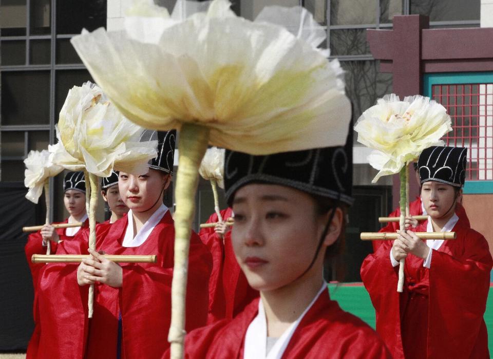 FILE - In this Feb. 25, 2015 file photo, South Korean students wearing traditional Korean costumes perform during a graduation ceremony at Sungkyunkwan University in Seoul, South Korea. While most people born in rich countries will live longer by 2030, with women in South Korea projected to reach nearly 91, Americans will continue to have one of the lowest life expectancies of any developed country, a new study published online Tuesday, Feb. 21, 2017 predicts. (AP Photo/Ahn Young-joon, File)