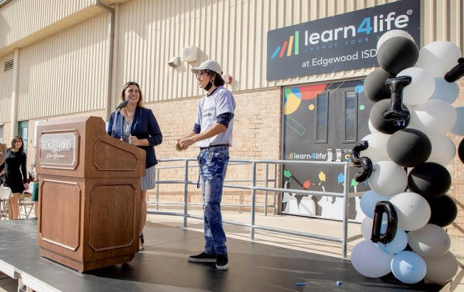Crissy Franco, left, principal of Learn4Life in San Antonio, Texas, and Graciano Garza, a student who graduated in December, at the school’s opening in August 2021. (Learn4Life at Edgewood Independent School District)