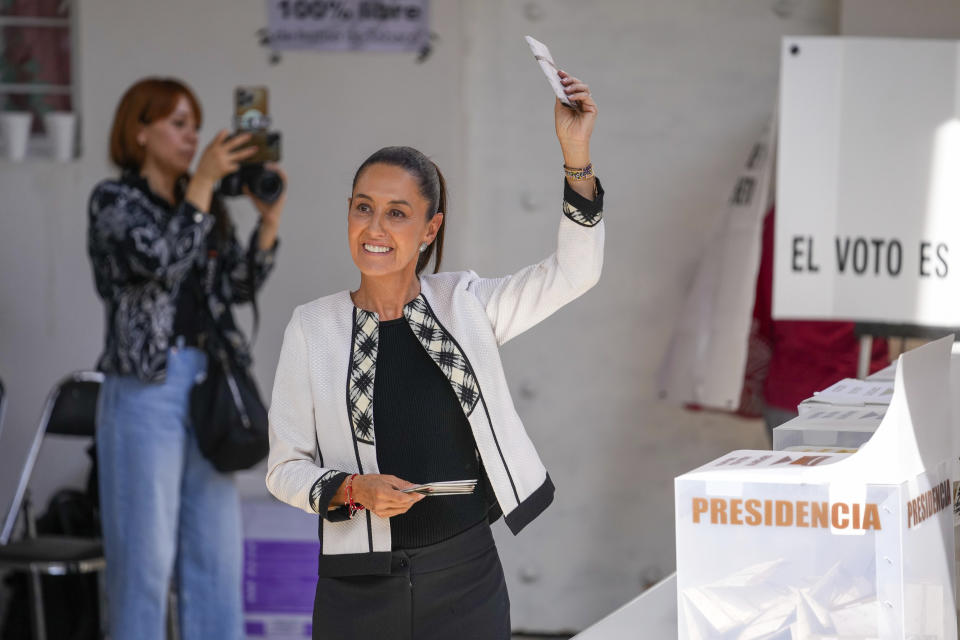 Ruling party presidential candidate Claudia Sheinbaum shows her ballot before voting during general elections in Mexico City, Sunday, June 2, 2024. (AP Photo/Matias Delacroix)