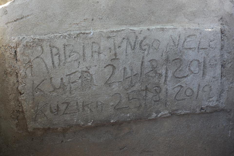 Rabia Issa was buried in a Muslim cemetery near where her family lives in Dar es Salaam. The headstone includes parts of her full name, Rabia Issa Mohamed Ngonelo, though she went by Rabia Issa.