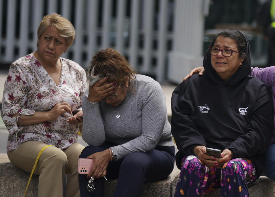 People gather outside after a magnitude 7.6 earthquake was felt in Mexico City, Monday, Sept. 19, 2022. The quake hit at 1:05 p.m. local time, according to the U.S. Geologic Survey, which said the quake was centered near the boundary of Colima and Michoacan states. (AP Photo/Fernando Llano)