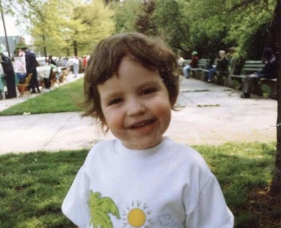 Dr. Kerry Magro as a child smiling in a picture outside (Courtesy Dr. Kerry Magro)