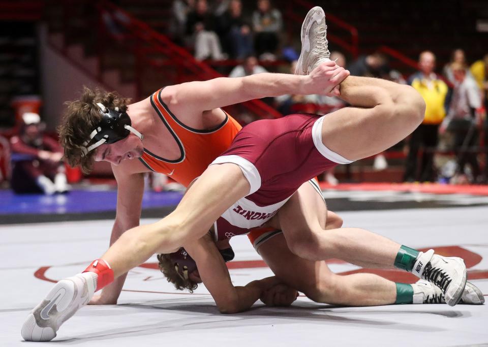 Kaukauna's Kolin DeGroot wrestles against Menomonie's Luke Pember in a 150-pound match during a Division 1 semifinal dual at the WIAA team state wrestling tournament Friday at the University of Wisconsin Field House in Madison.