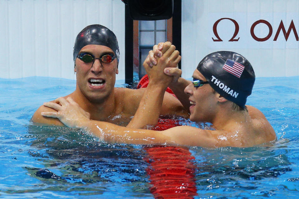 LONDON, ENGLAND - JULY 30: (L-R) Matt Grevers of the United States and Nick Thoman of the United State celebrate after Grevers won and Thoman finished second in the Final of the Men's 100m Backstroke on Day 3 of the London 2012 Olympic Games at the Aquatics Centre on July 30, 2012 in London, England. (Photo by Cameron Spencer/Getty Images)