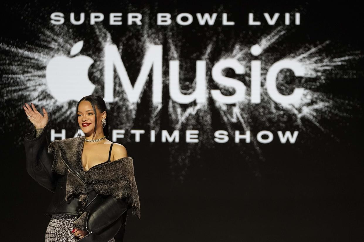 Rihanna poses for a photo after a halftime show news conference ahead of the Super Bowl 57 NFL football game, Thursday, Feb. 9, 2023, in Phoenix. (AP Photo/Mike Stewart)