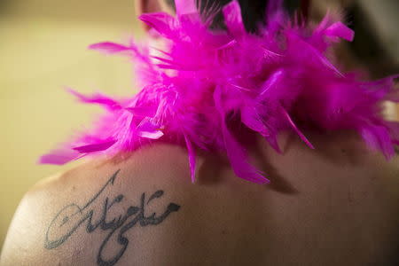 A tattoo is seen on the shoulder of Karam Dadu, a transvestite homosexual Israeli Arab, as he prepares for a drag show in Tel Aviv June 5, 2015. REUTERS/Baz Ratner