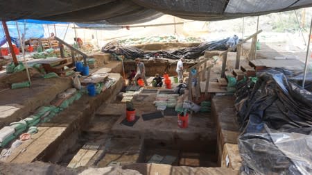 Handout photo of excavation work by scientists at the Cooper's Ferry archaeological site located along the Salmon River in western Idaho