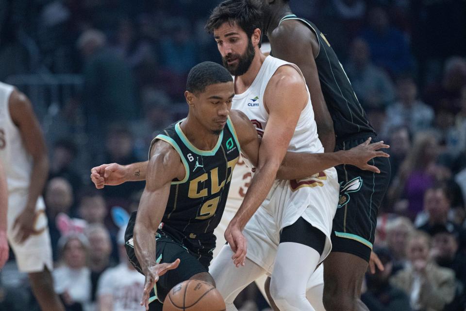 Charlotte Hornets' Theo Maledon (9) drives past Cleveland Cavaliers' Ricky Rubio (13) during the first half of an NBA basketball game in Cleveland, Sunday, April 9, 2023. (AP Photo/Phil Long)