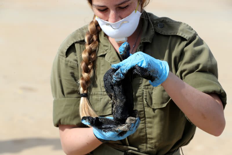 FILE PHOTO: Israel's beaches blackened by tar after offshore oil spill