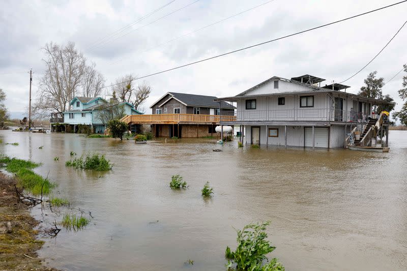 FILE PHOTO: Houses sit partly underwater after the San Joaquin River overflowed, in Manteca