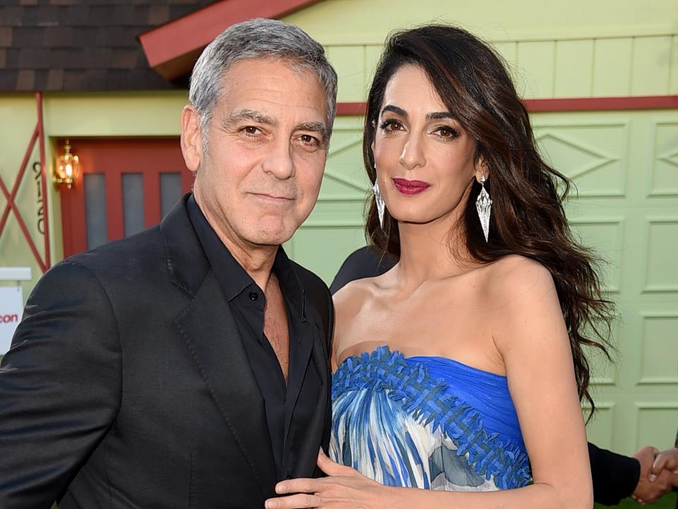 George Clooney and his wife Amal Clooney arrive at the premiere of Paramount Pictures' "Suburbicon" at the Village Theatre on October 22, 2017 in Los Angeles, California