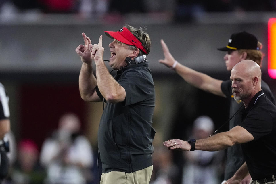 Georgia head coach Kirby Smart, left, yells to his players on the field during the second half of an NCAA college football game against Missouri, Saturday, Nov. 4, 2023, in Athens, Ga. (AP Photo/John Bazemore)