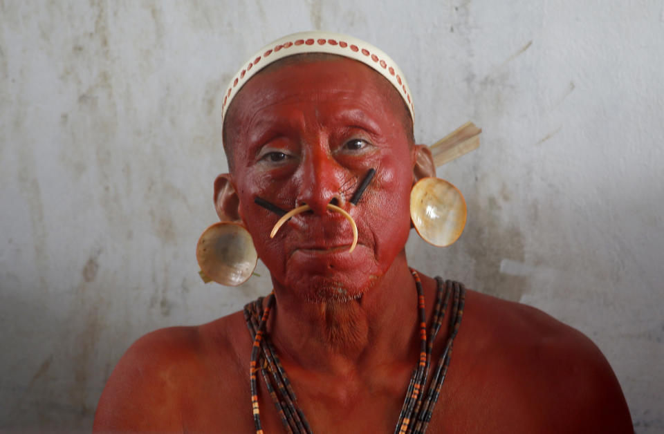 A Matis Indigenous man looks at the camera during a protest against the disappearance of Indigenous expert Bruno Pereira and freelance British journalist Dom Phillips, in Atalaia do Norte, Vale do Javari, Amazonas state, Brazil, Monday, June 13, 2022. Brazilian police are still searching for Pereira and Phillips, who went missing in a remote area of Brazil's Amazon a week ago. (AP Photo/Edmar Barros)