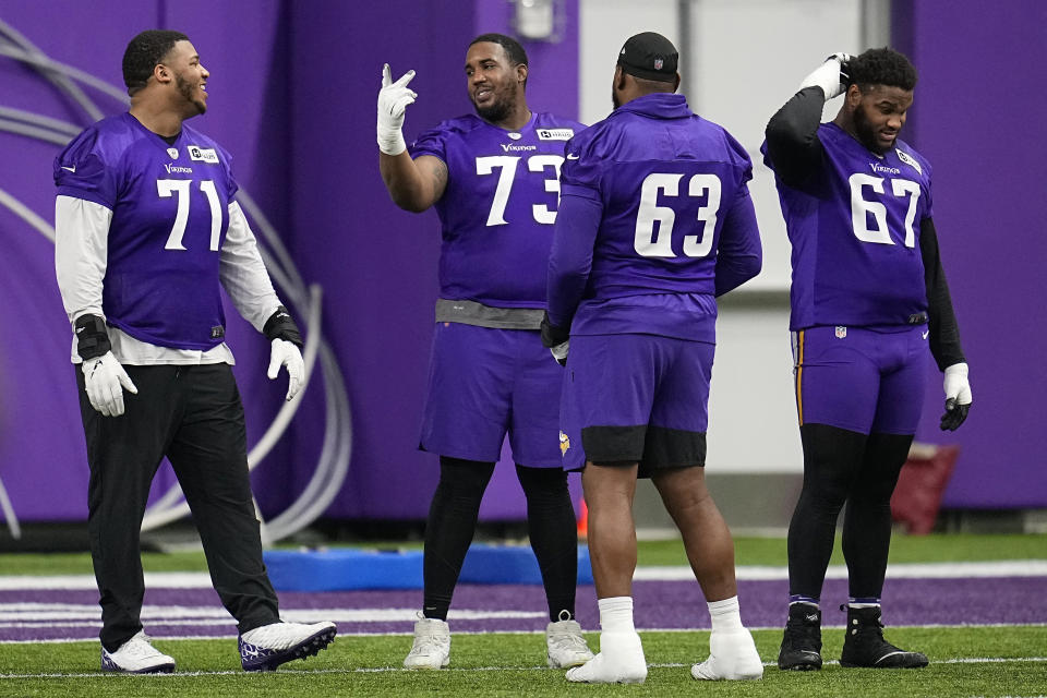 Minnesota Vikings offensive tackle Bobby Evans (73), middle, talks with teammates during an NFL football team practice in Eagan, Minn., Wednesday, Jan. 11, 2023. The Vikings will play the New York Giants in a wild-card game on Sunday. (AP Photo/Abbie Parr)